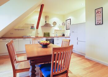Kitchen with dining table Holiday home Taubenschlag